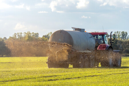 Tractor spraying manure